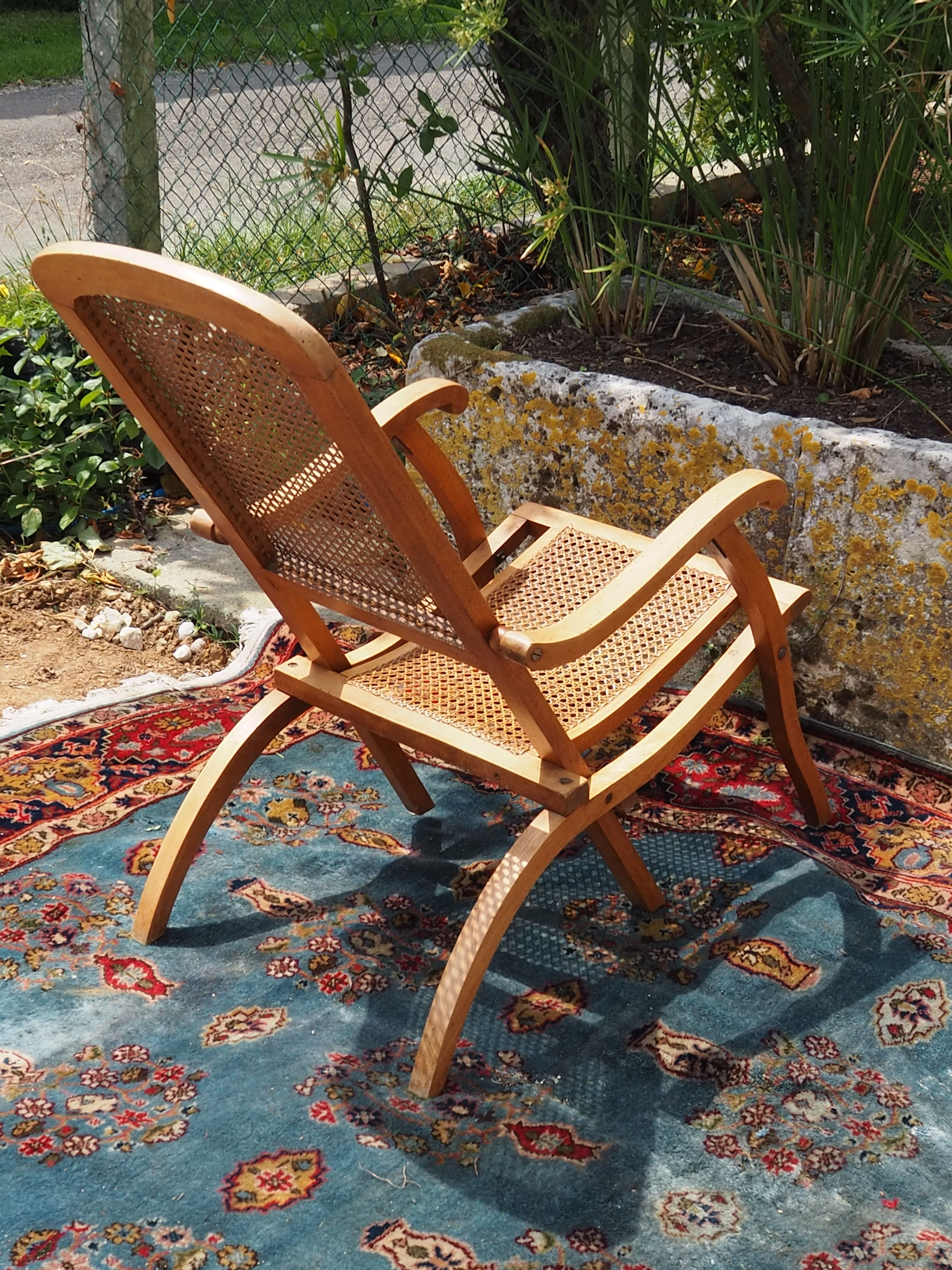 Cane folding armchair in solid wood