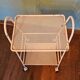 Perforated white metal serving trolley
