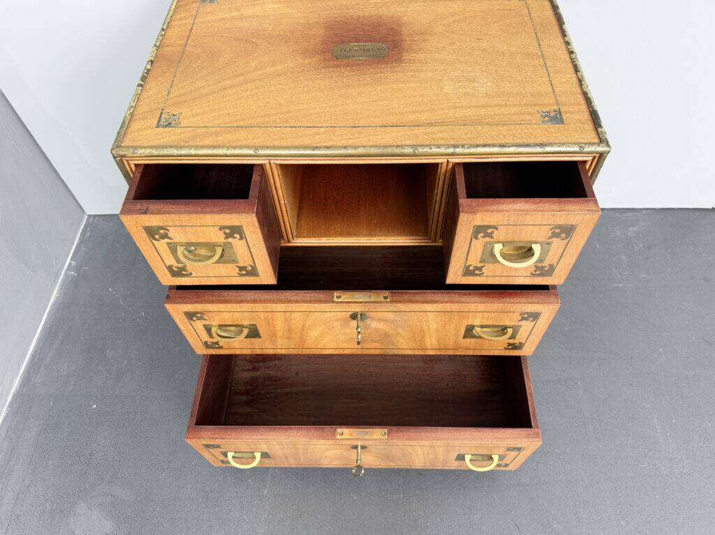 Antique campaign chest / ship’s chest, England, 1940s. Mahogany with a distinctive grain, brass inlays and hardware.
