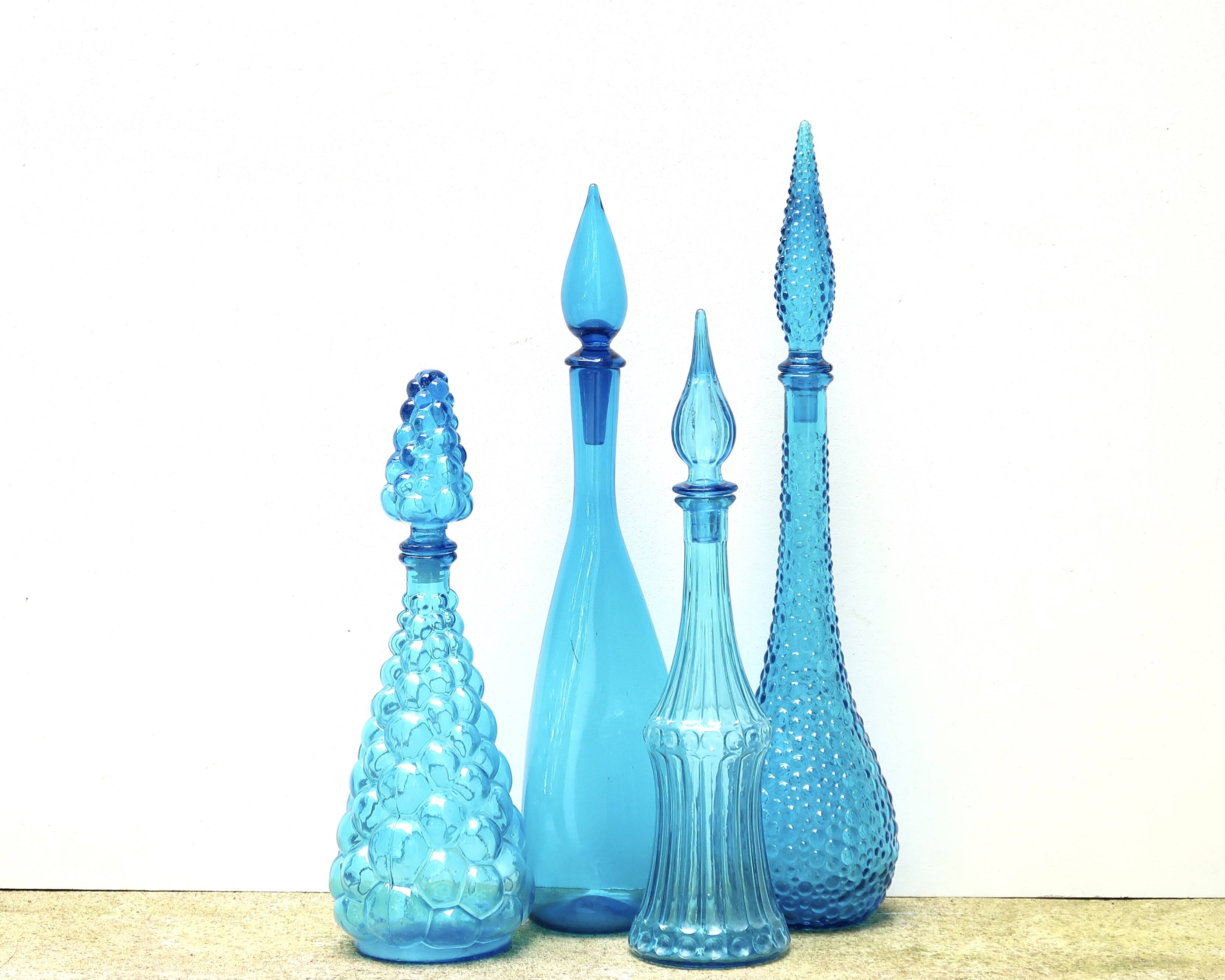Set of four Italian blue glass carafes, 1960s