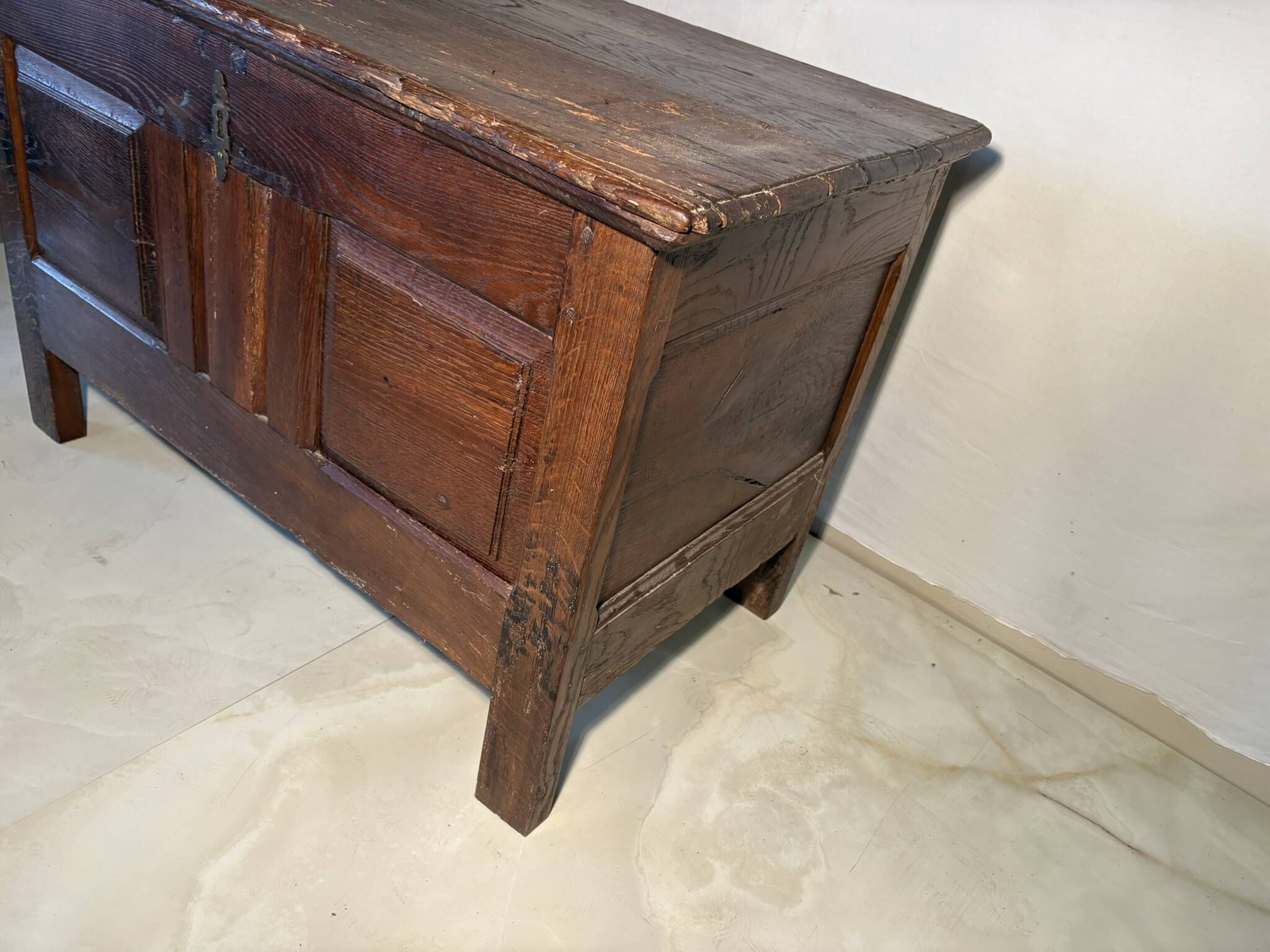 Rustic antique oak chest, original fittings and moulded panels.