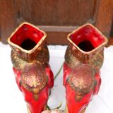 A pair of red and gold ceramic vases in the shape of elephants, 1940s.