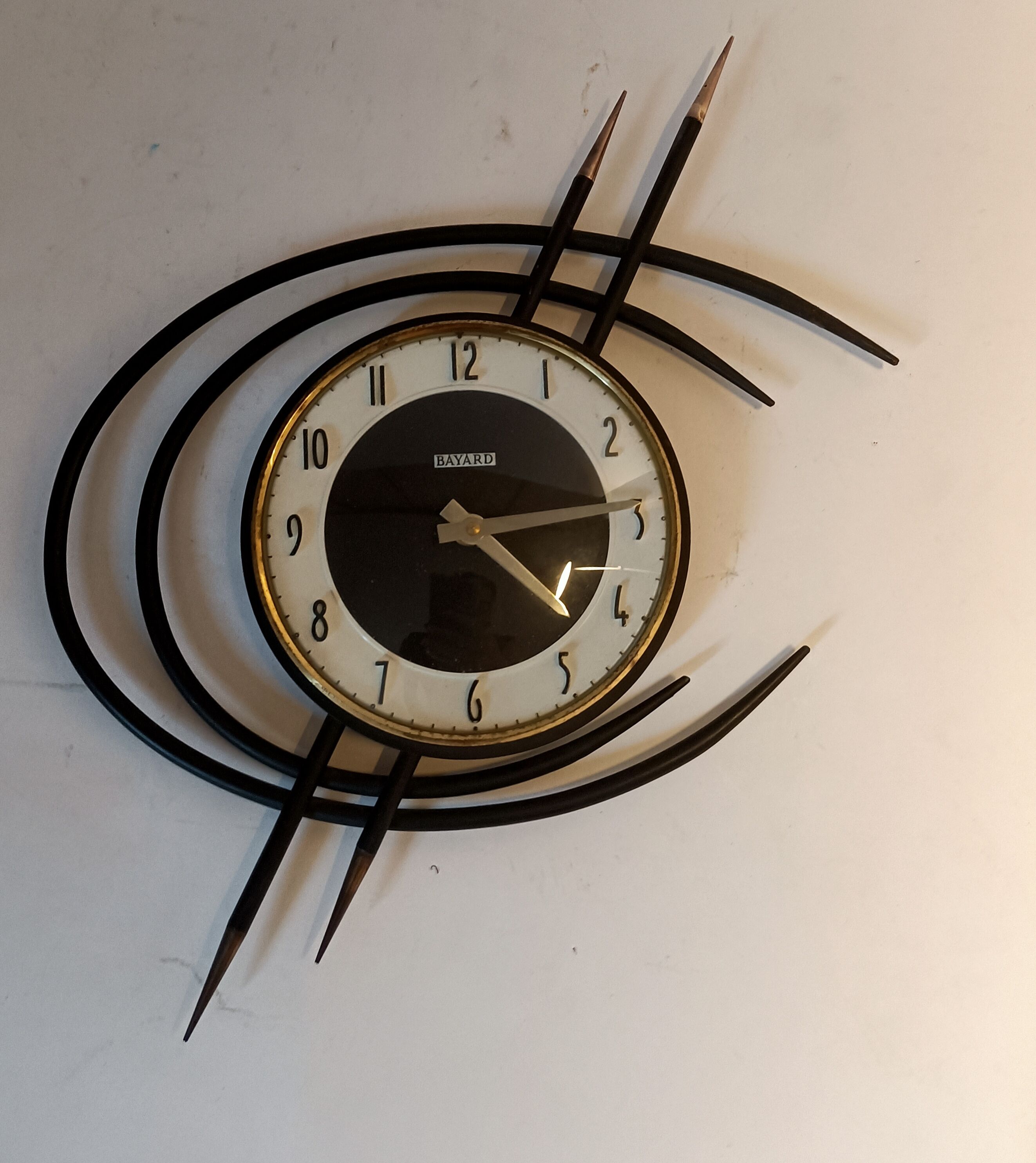 Bayard ortf wall clock in black metal and gilded brass. 1960