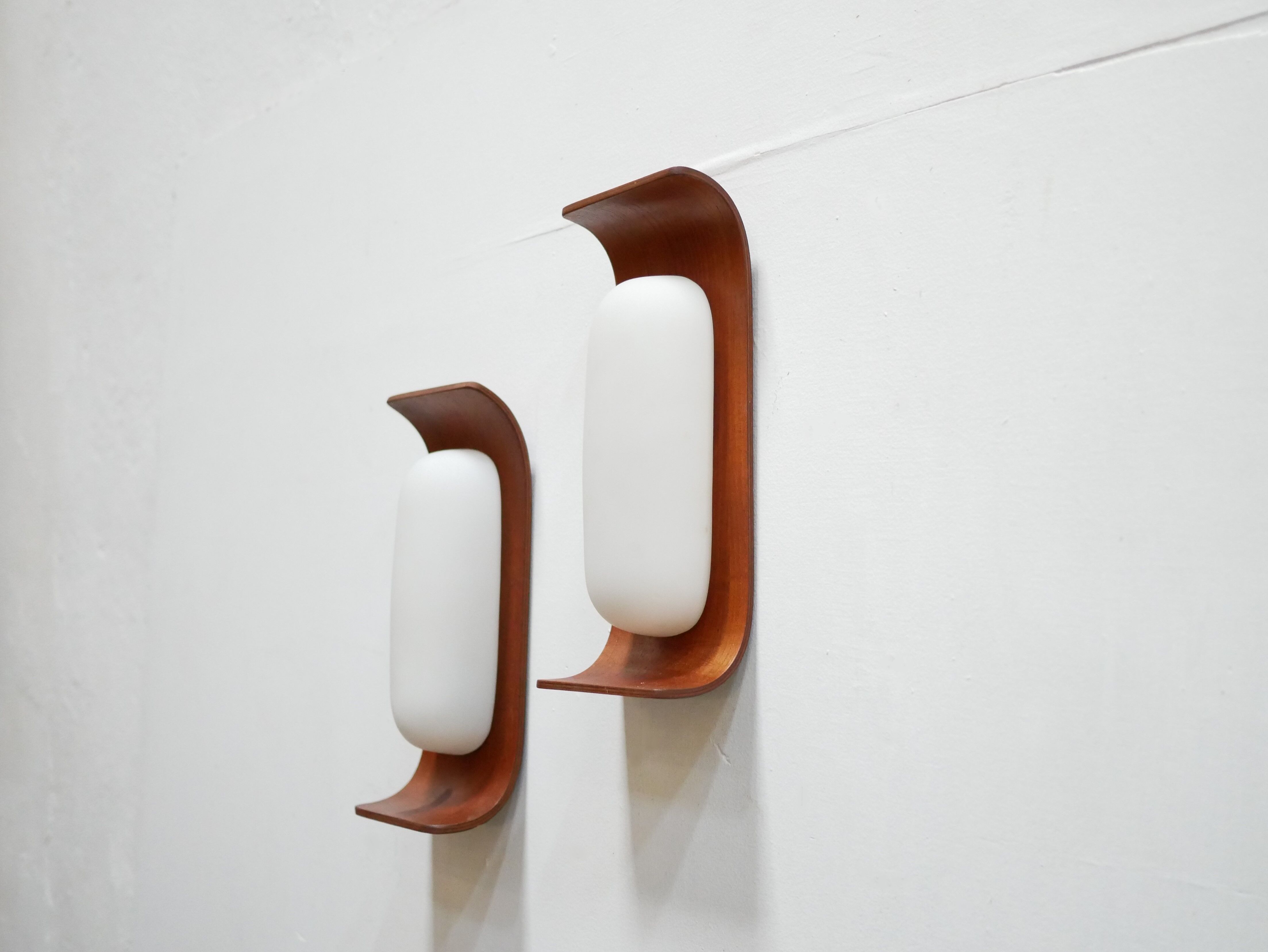 Pair of teak and opaline wall lamps by Goffredo Reggiani