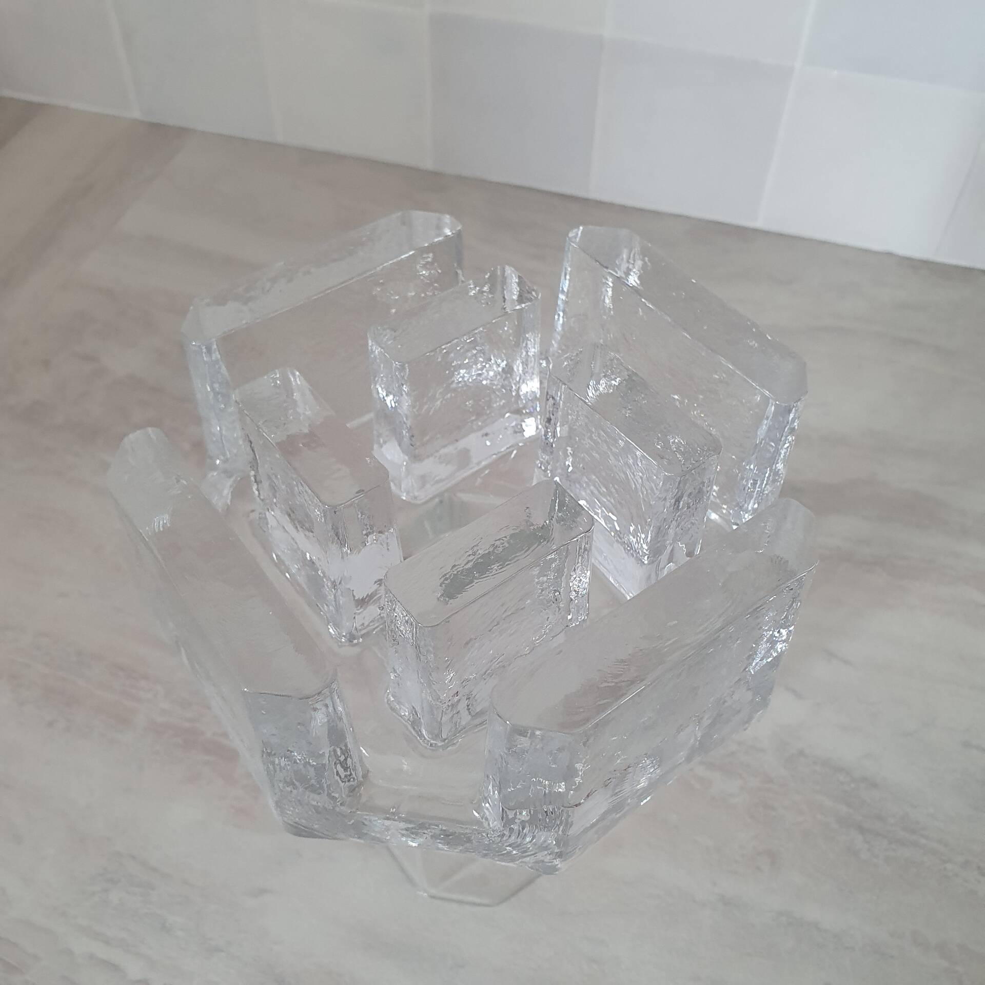 Candle holder or glass warmer with irregular ice effect.