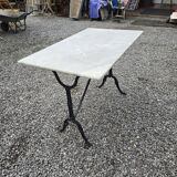 Bistro table with marble top and cast iron base