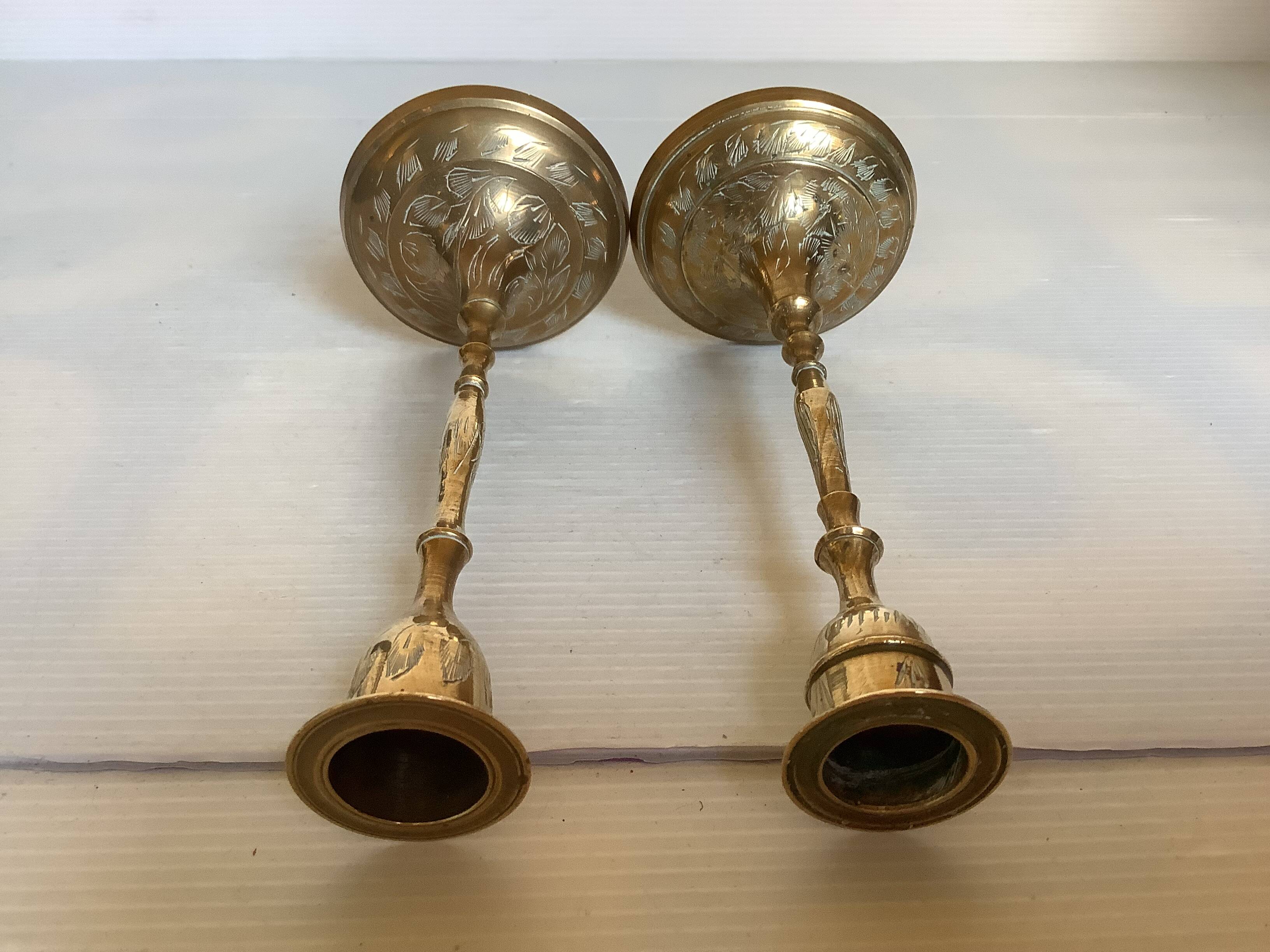 Pair of worked brass candlesticks