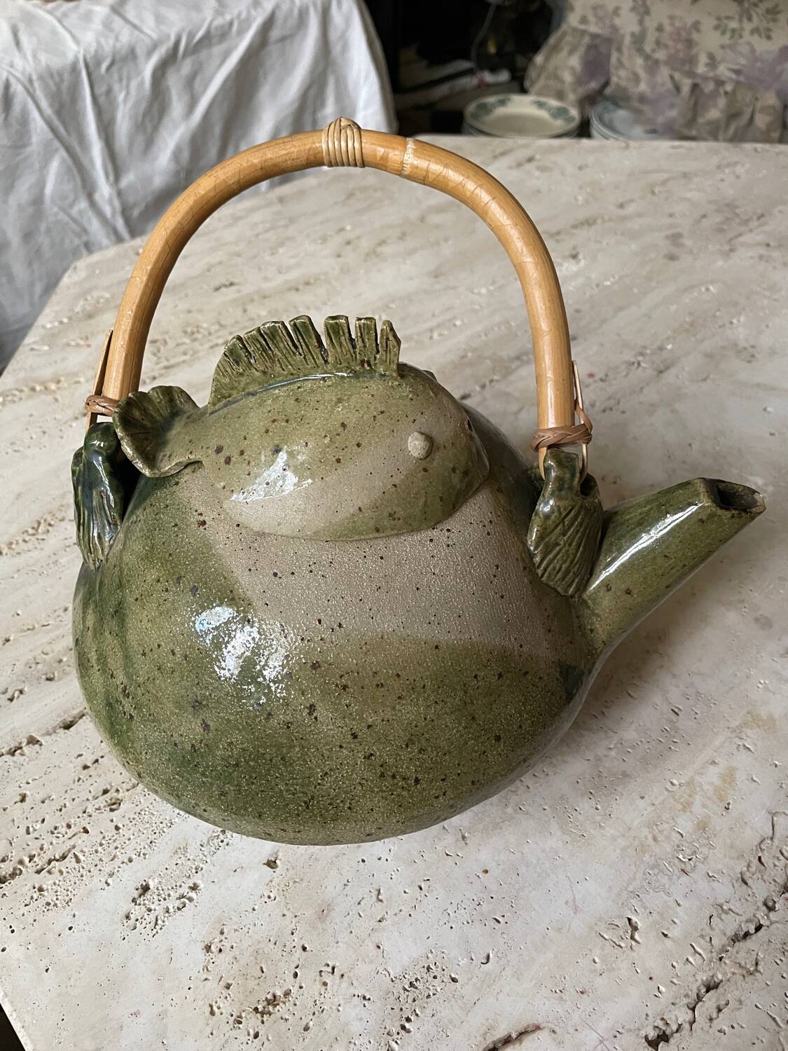 Handmade ceramic teapot with green fish and bamboo