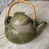 Handmade ceramic teapot with green fish and bamboo