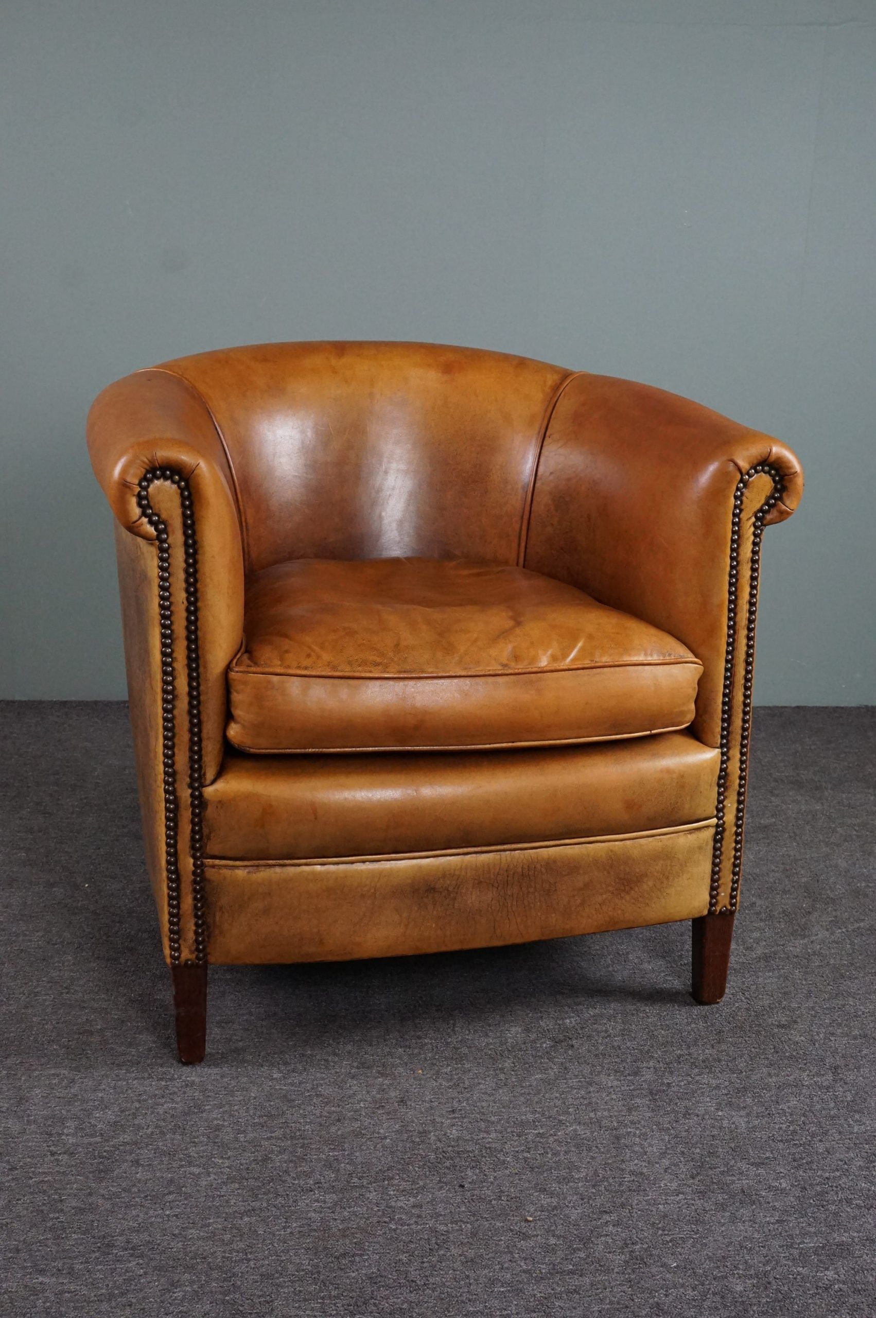 Club armchair in cognac-colored sheepskin