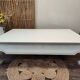 Exotic wood coffee table with its safety glass protection.