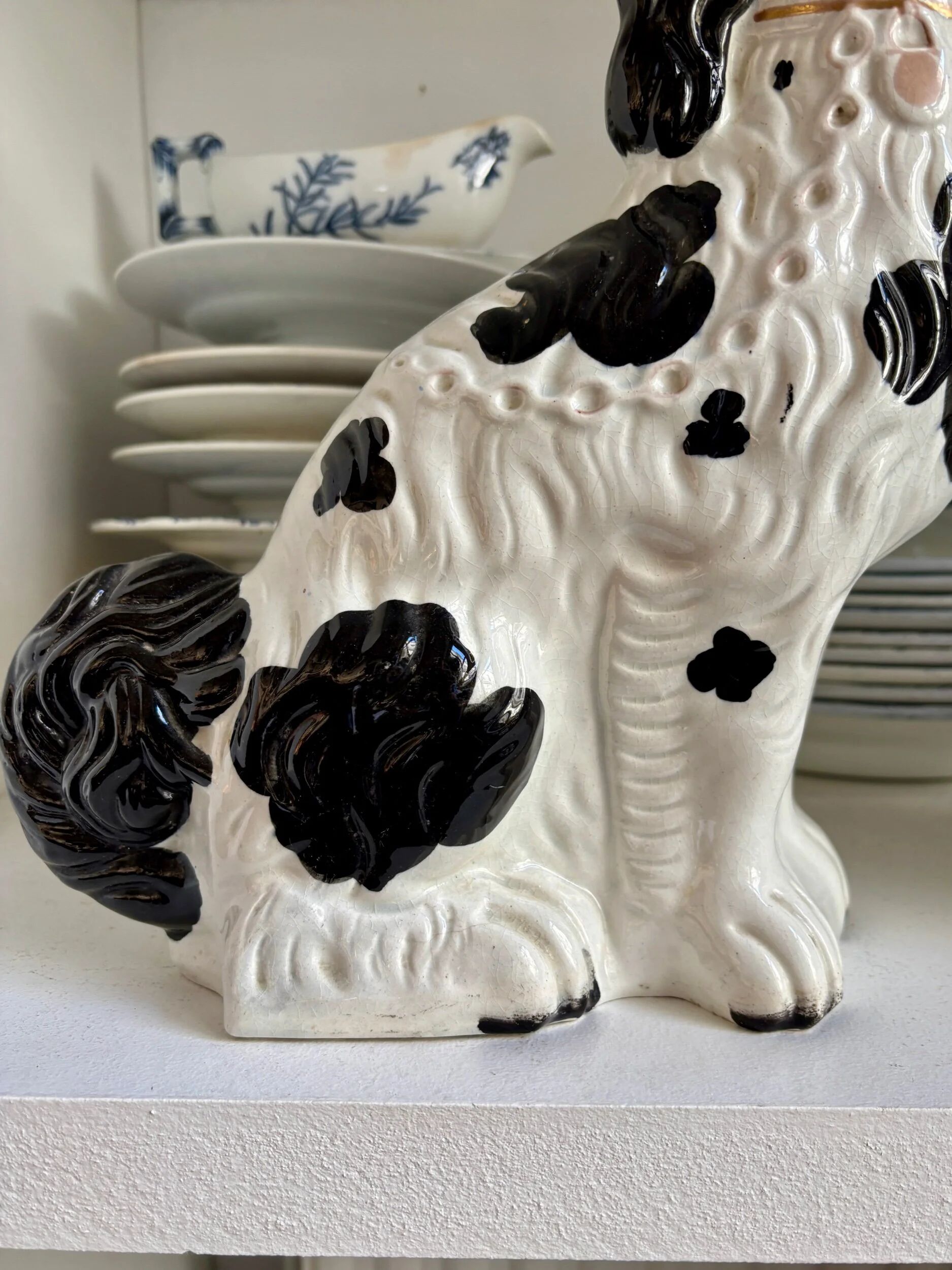 Pair of black Cavalier King Charles dogs in Staffordshire pottery, 19th century.