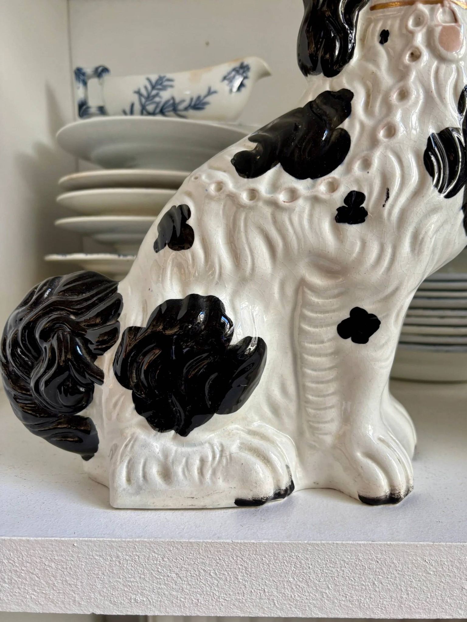 Pair of black Cavalier King Charles dogs in Staffordshire pottery, 19th century.