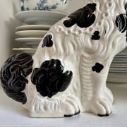 Pair of black Cavalier King Charles dogs in Staffordshire pottery, 19th century.