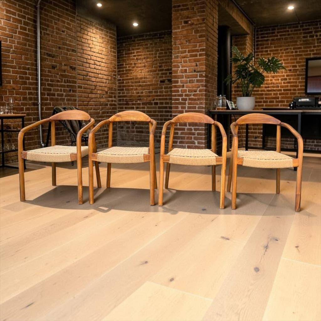 Set of 4 solid wood chairs with cord and armrests.