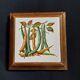 Dessous de plat ancien avec motif botanique