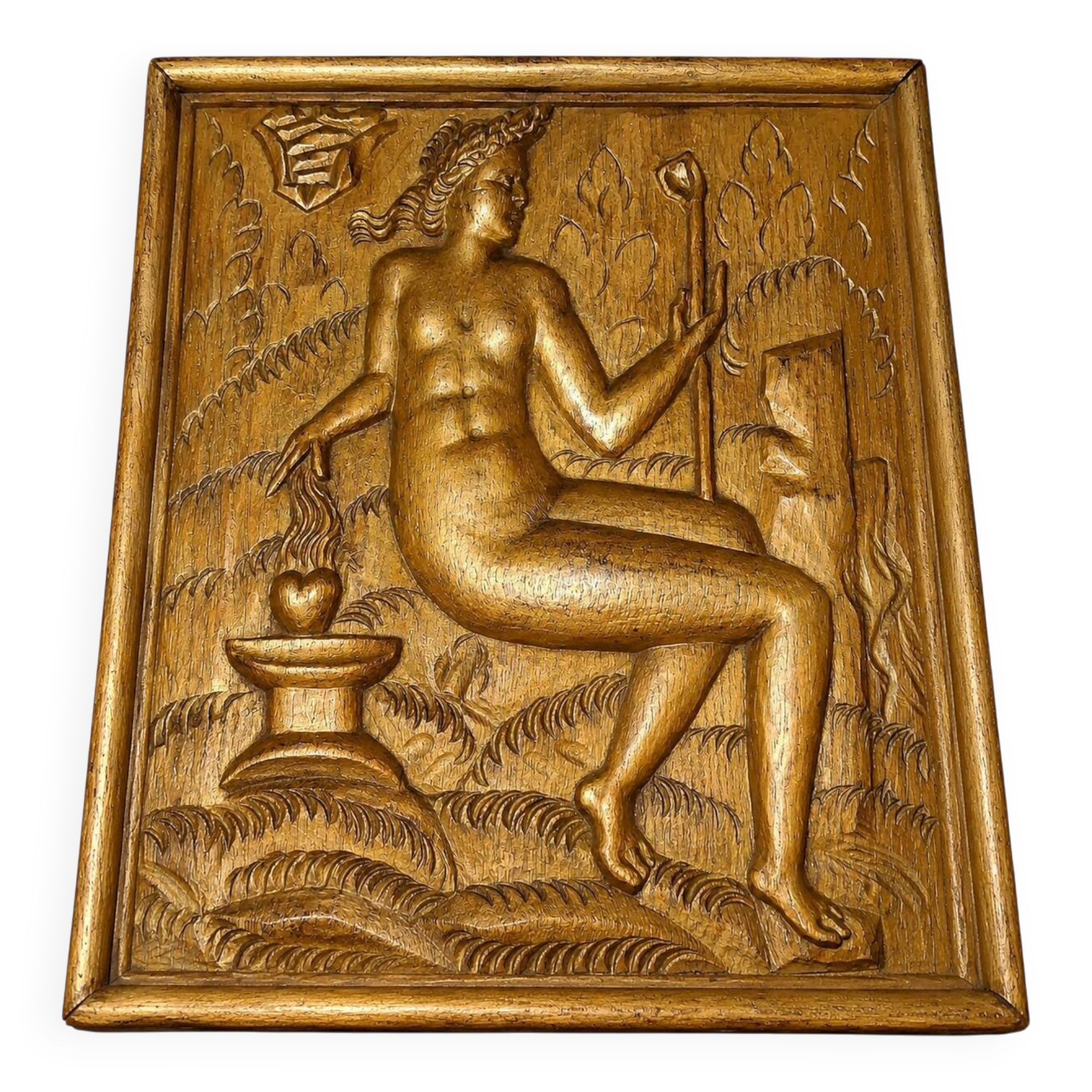 Carved oak panel depicting an allegorical female figure.