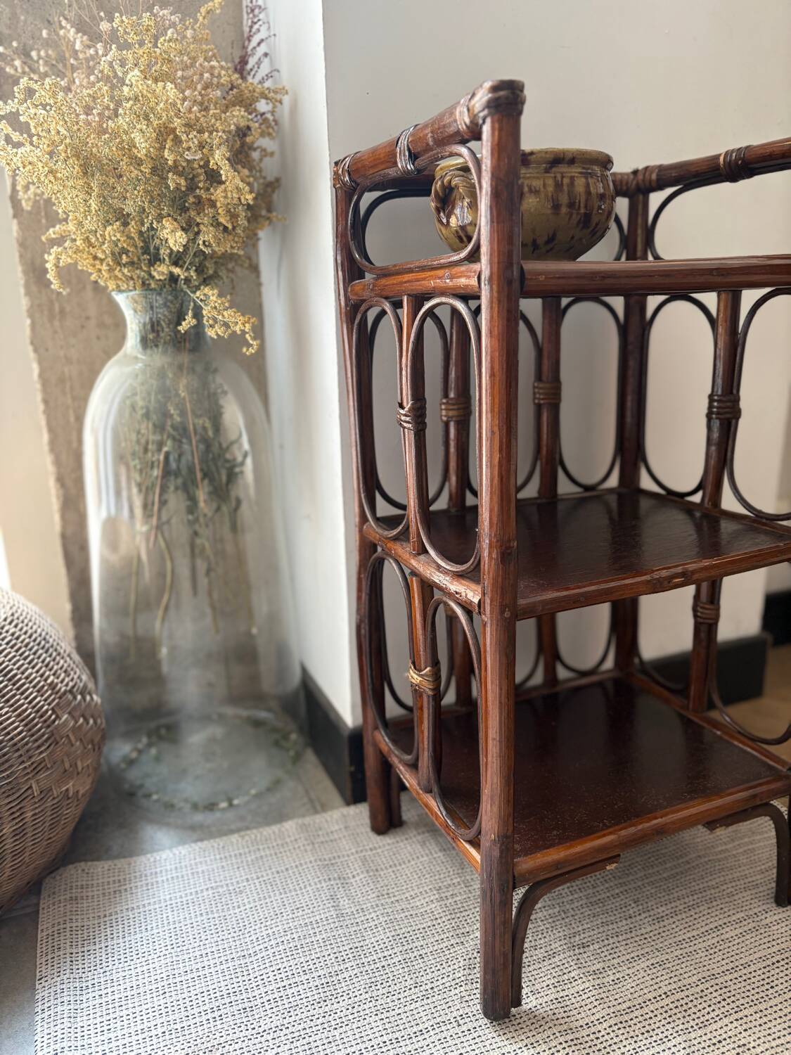 Dark brown 70s bamboo and cane shelf on legs
