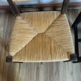 Pair of low wooden and straw armchairs
