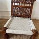 Pair of traditional Indian chairs made of carved wood and rope