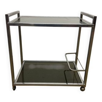 1970s coffee table in brass with a double smoked glass top.