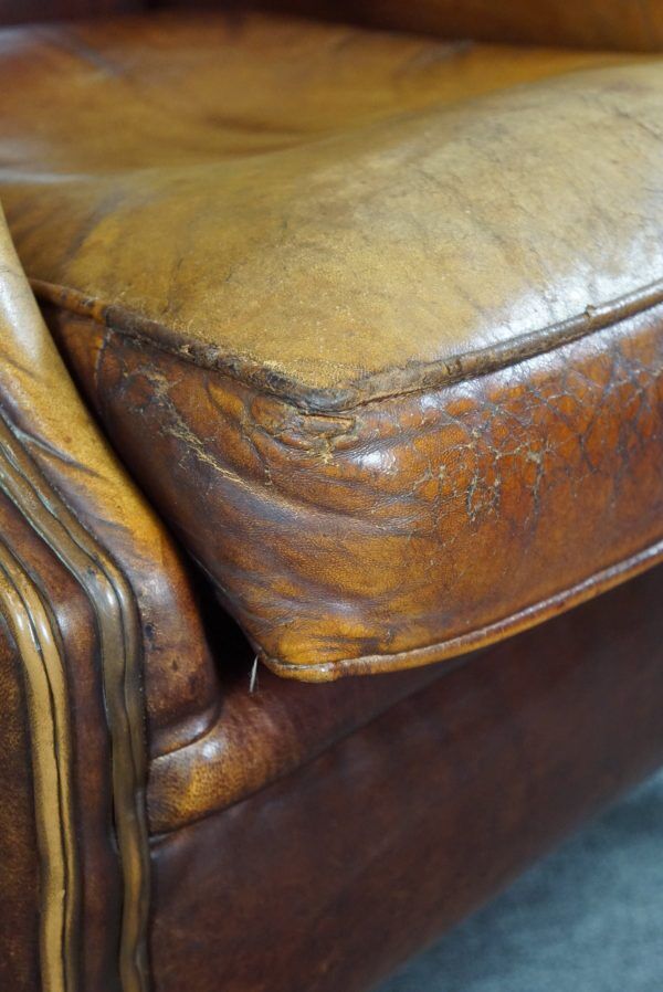 Armchair in patinated sheepskin leather