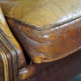 Armchair in patinated sheepskin leather