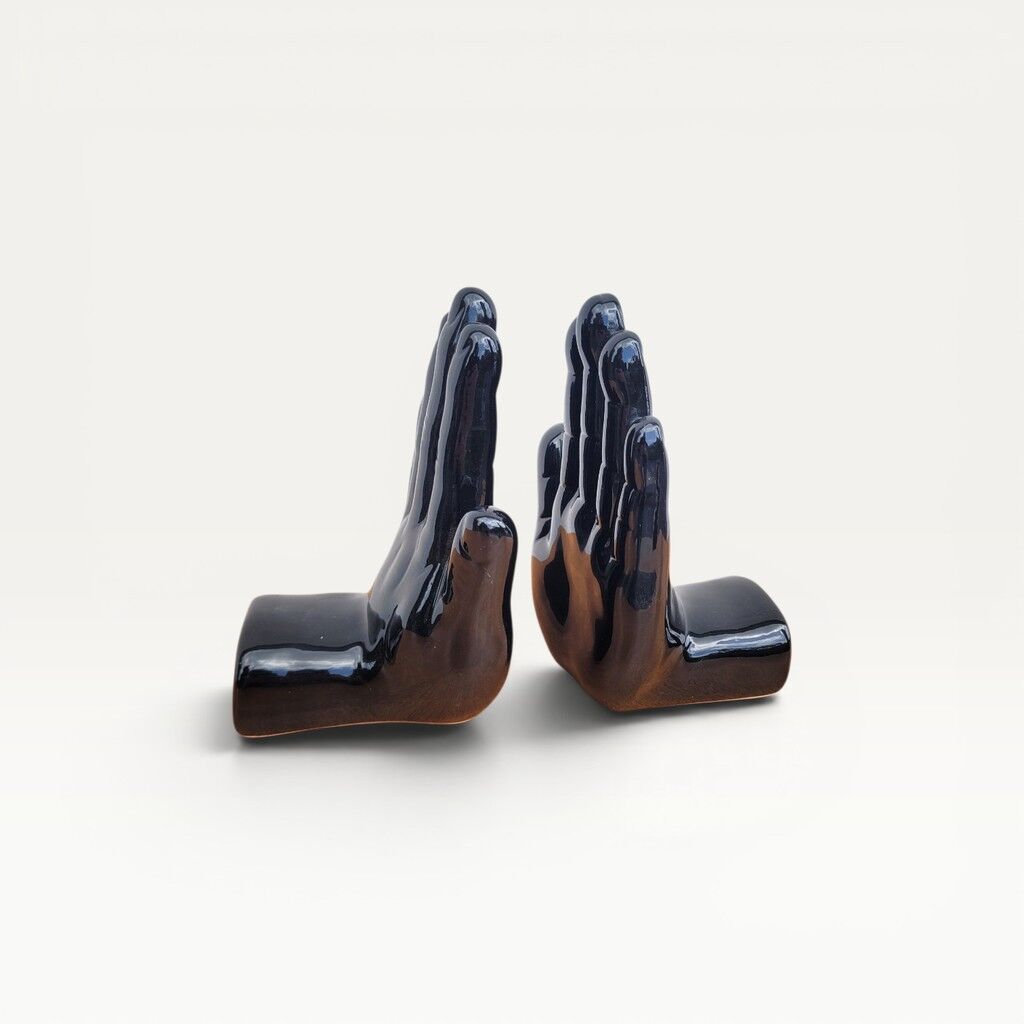 Pair of vintage black ceramic hand bookends