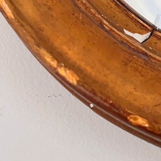 Witch's mirror with wood frame and curved ice