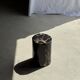 Black petrified wood side table with beige stripes, star pattern H35 D24.