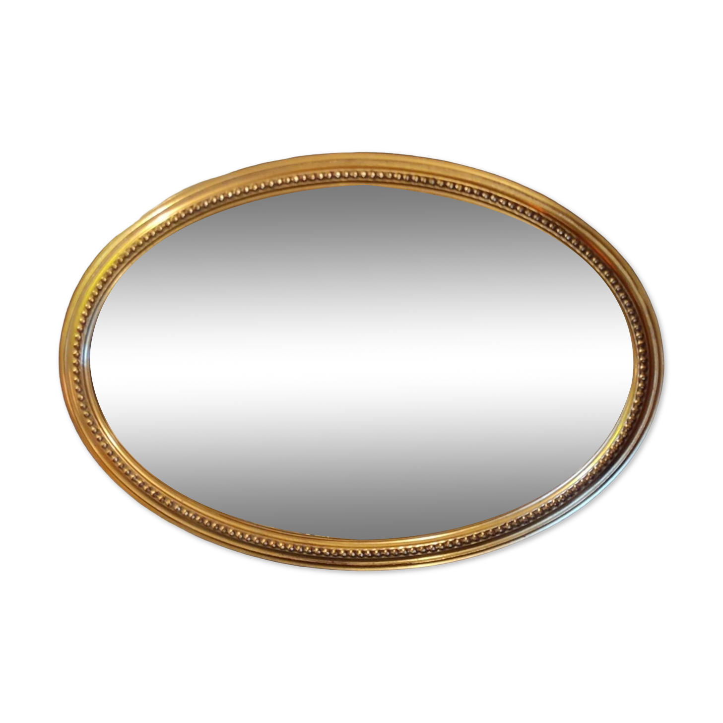Old oval beveled golden mirror