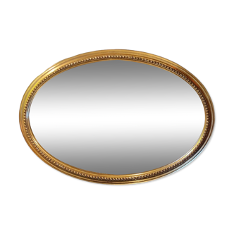 Ancien miroir doré biseauté ovale