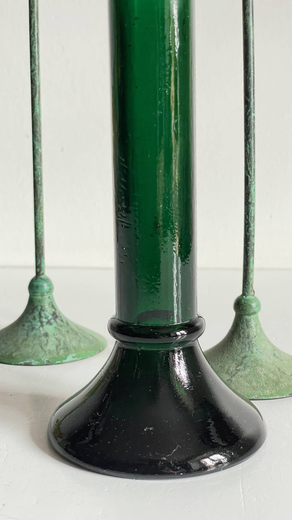 Green glass and metal candle holders