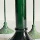Green glass and metal candle holders