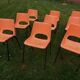 9 vintage orange plastic adult chairs