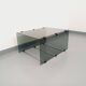 Table basse vintage en verre fumé, métal noir et fonte d’aluminium