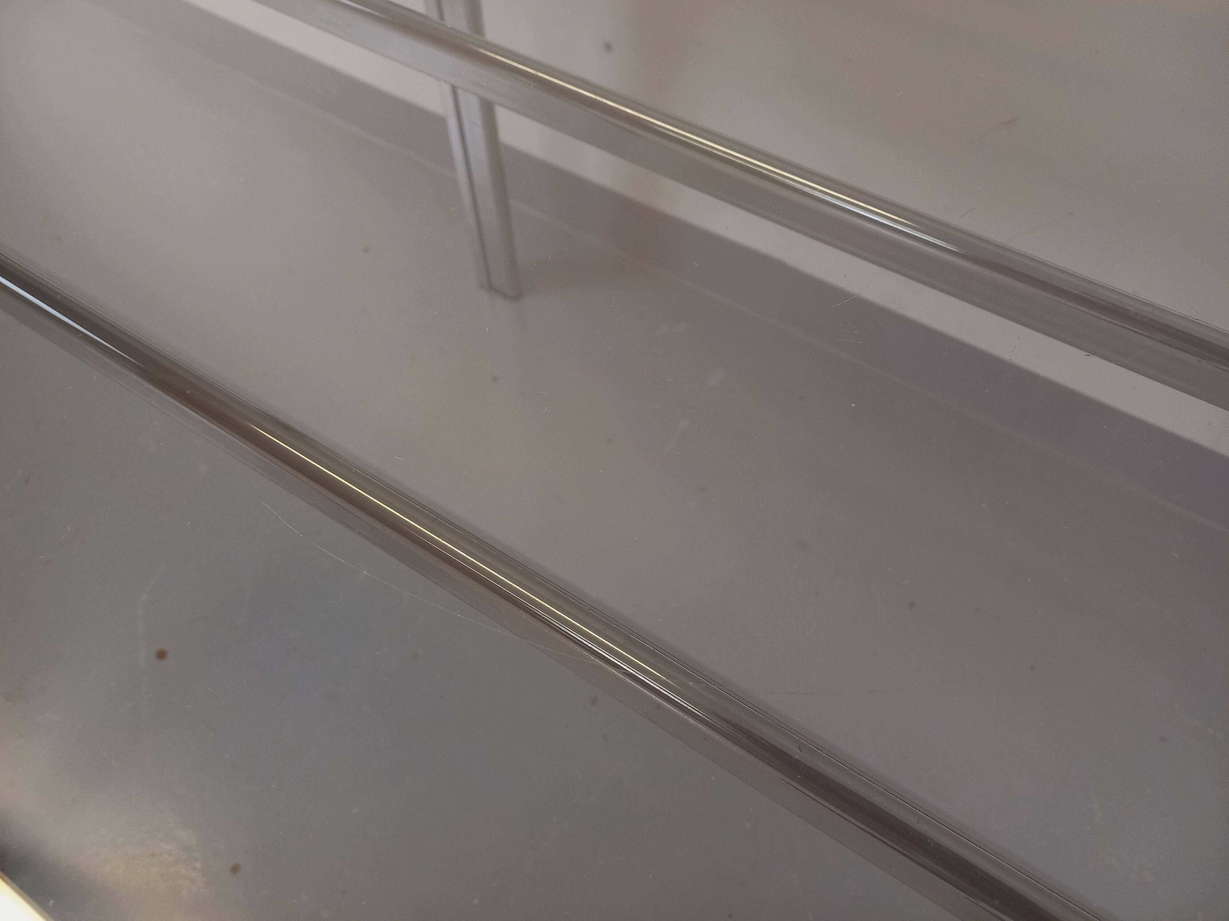 Vintage oval dining table in smoked glass and chrome metal, Space Age style.