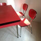 Table and chairs in vintage red formica 60s