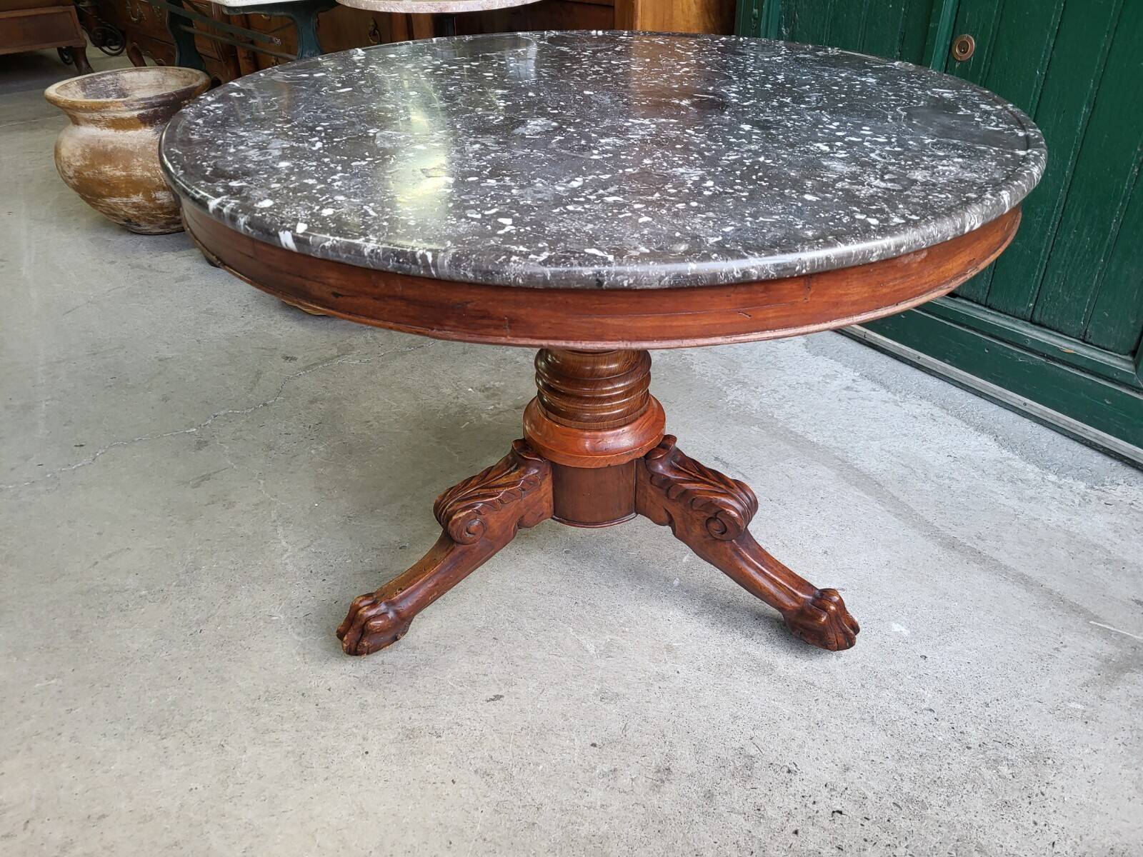 Round pedestal table with marble top and mahogany tripod from the 19th century