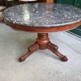 Round pedestal table with marble top and mahogany tripod from the 19th century