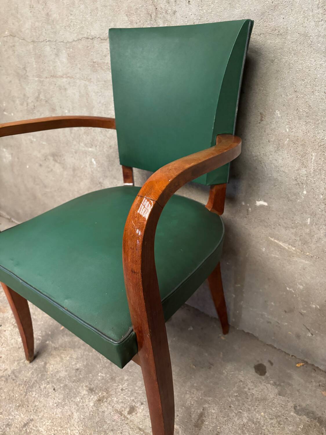 Green faux leather bridge chair
