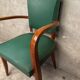 Green faux leather bridge chair