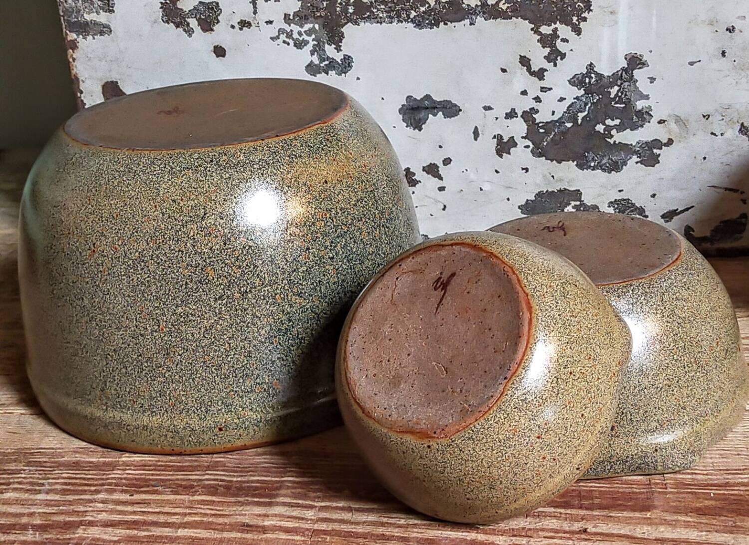 Three nesting pottery salad bowls in glazed stoneware