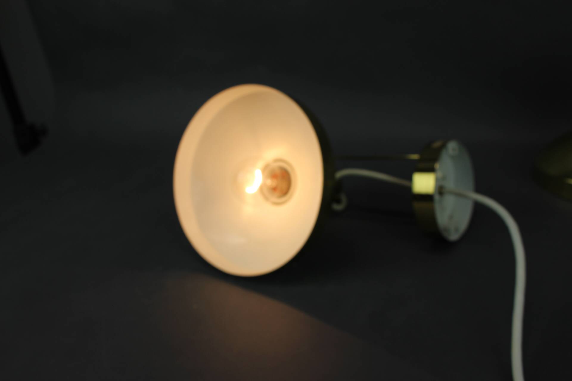 Set of four adjustable brass wall lights, Germany, 1960s.