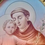 Old religious light frame in gilded stucco and curved glass