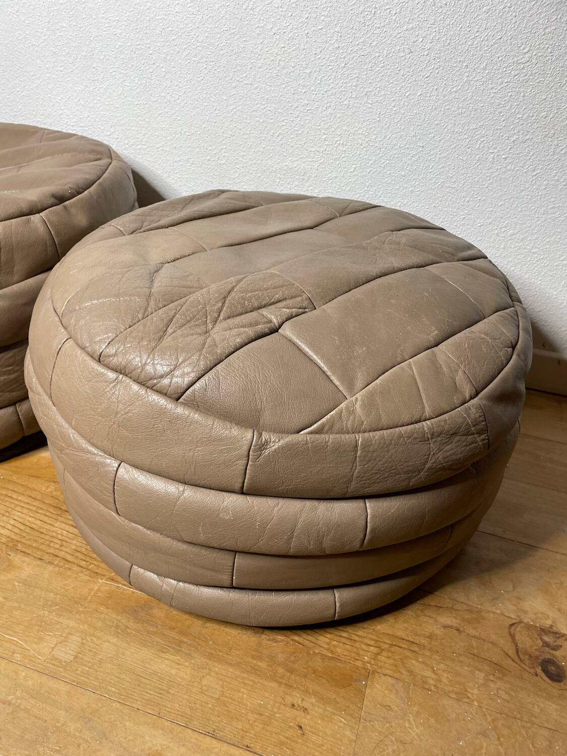 Pair of De Sède patchwork leather poufs