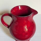 Vintage red enamel ceramic pitcher