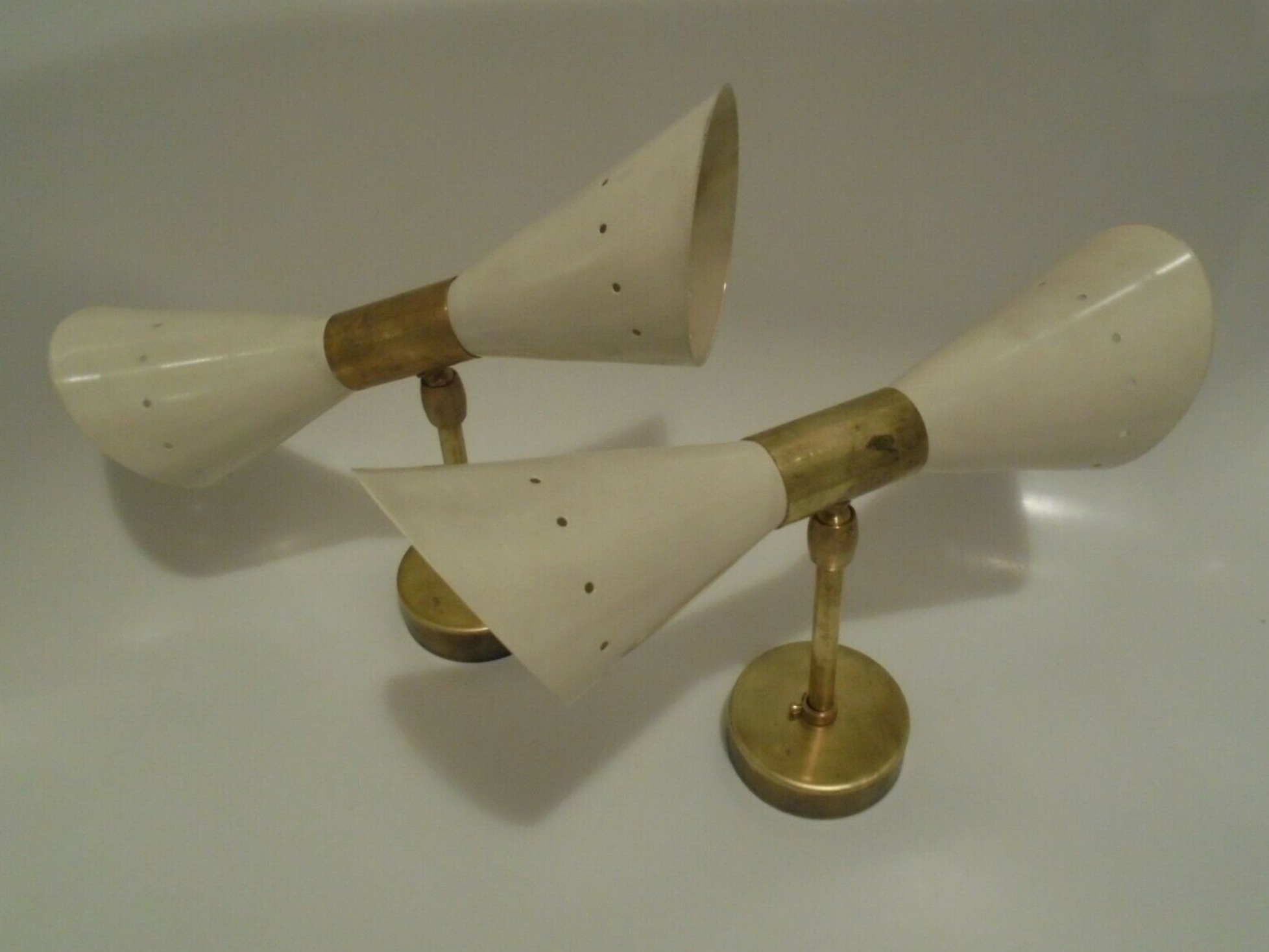 Pair of wall sconces remembering the Italian creations from the 50s and 60's