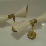 Pair of wall sconces remembering the Italian creations from the 50s and 60's