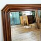Miroir octogonal en bois.